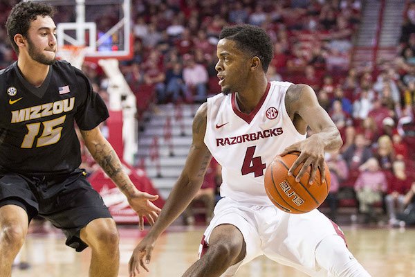 Daryl Macon (4) of Arkansas bring the ball down the court as Jordan Geist (15) defends from Missouri at Bud Walton Arena, Fayetteville, AR, Saturday, January 14, 2017.