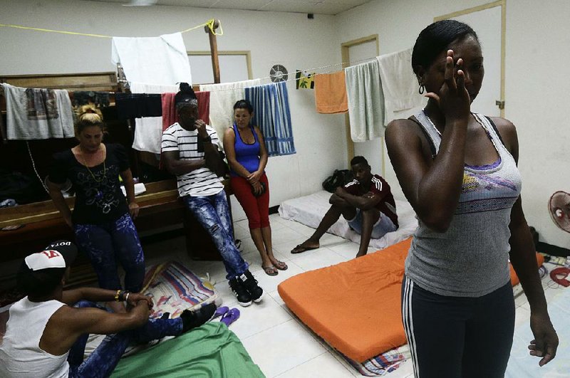 Yarisel Isac Wilson, a Cuban migrant, cries Thursday at a Panama City shelter as she talks about her attempt to reach the U.S., a journey upended by the U.S.’ decision to end its “wet foot, dry foot” policy.