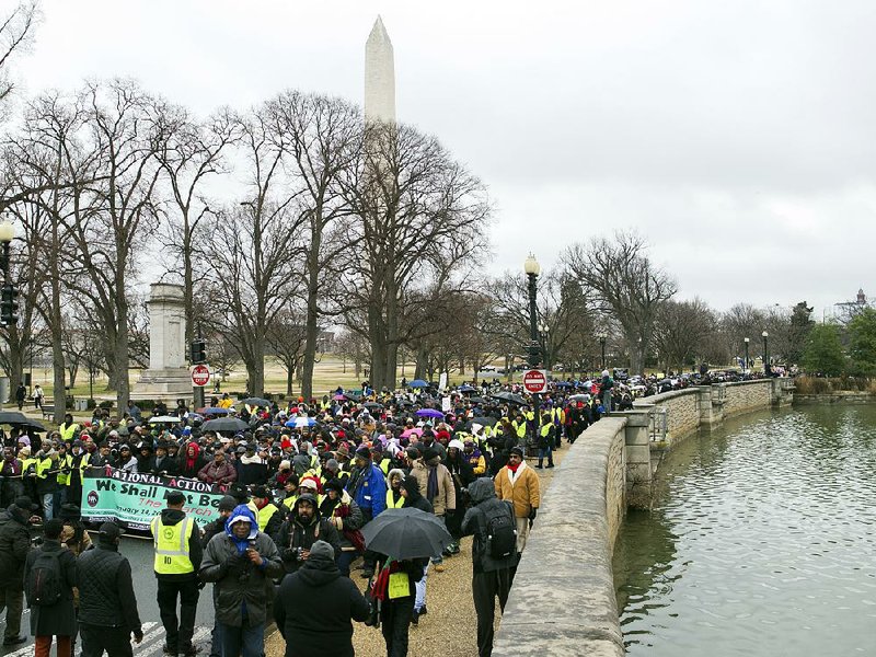 Civil-rights activists march Saturday in Washington ahead of the Martin Luther King Jr. holiday.
