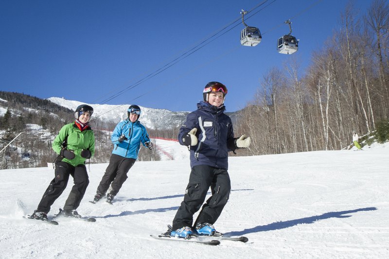 This Jan. 14, 2015 photo provided by ORDA/Whiteface Lake Placid, shows Megan Gardner, right, as she teaches participants in a lesson at Whiteface Mountain in Wilmington, N.Y., near Lake Placid. 