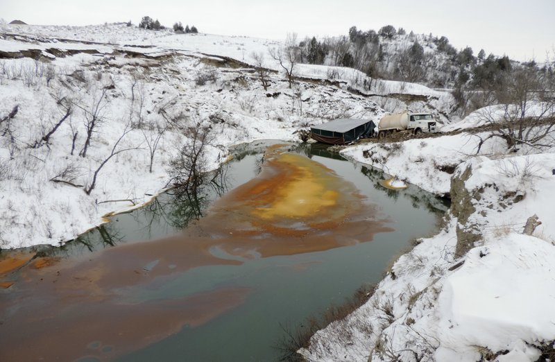 This Dec. 10, 2016, file photo, provided by the North Dakota Department of Health shows an oil spill from the Belle Fourche Pipeline that was discovered Dec. 5, 2016 in Ash Coulee Creek, a tributary of the Little Missouri River, near Belfield, N.D. 