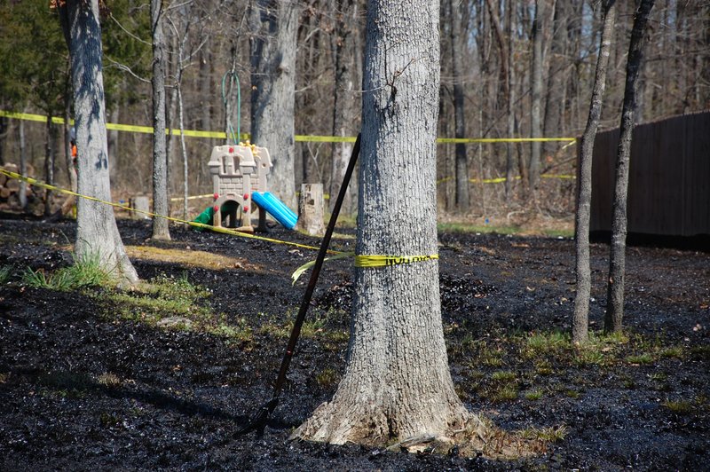 FILE - In this Monday, April 1, 2013, file photo, oil covers the ground around a slide in Mayflower, Ark., days after a pipeline ruptured and spewed oil over lawns and roadways. Exxon Mobil denied claims from plaintiffs in an oil spill lawsuit that it made all information about the maintenance and repair of an oil pipeline secret. President Barack Obama's administration has scaled back new safety measures for the sprawling network of fuel pipelines that crisscross the United States after complaints from industry over the potential cost. The administration on Friday, Jan. 13, 2017, finalized new regulations for almost 200,000 miles of pipelines that transport crude oil, gasoline and other hazardous liquids. A proposed requirement for companies to immediately repair problems discovered on their lines was dropped. (AP Photo/Jeannie Nuss, File)