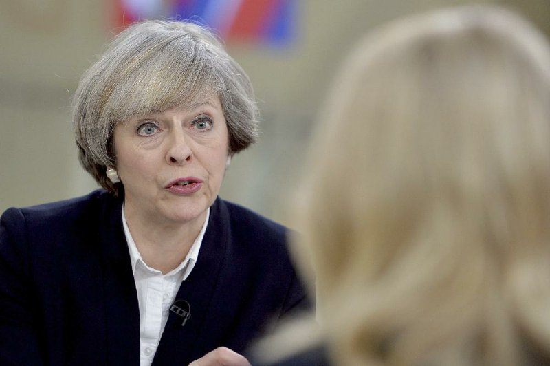 Britain's Prime Minister Theresa May, left, is interviewed by Sophy Ridge for a television channel, in London, Sunday Jan.  8, 2017.