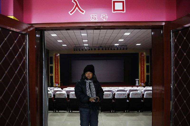 A man leaves the main screening hall of the Digital Cinema in Zhuolu County in north China’s Hebei province last month.
