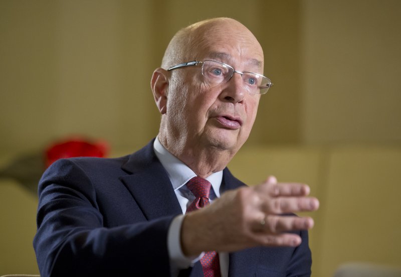 President and Founder of the World Economic Forum, Klaus Schwab, gestures as he speaks during an interview with The Associated Press in Davos, Switzerland, Sunday Jan. 15, 2017. Business and world leaders are gathering for the annual meeting in Davos. 