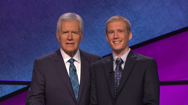 "Jeopardy!" host Alex Trebek (left) stands with Fayetteville contestant Eli Nehus (right).