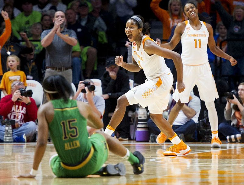 Tennessee forward Jordan Reynolds (right) celebrates after Notre Dame’s Lindsey Allen missed a last-second jumper, allowing the Lady Volunteers to pull out a 71-69 upset Monday over the Fighting Irish.