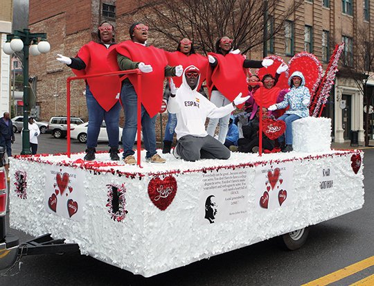 The Sentinel-Record/Richard Rasmussen MLK PARADE: Participants perform while riding on the St. Mark Baptist Church's float during the annual Martin Luther King Jr. Day parade in downtown Hot Springs Monday.
