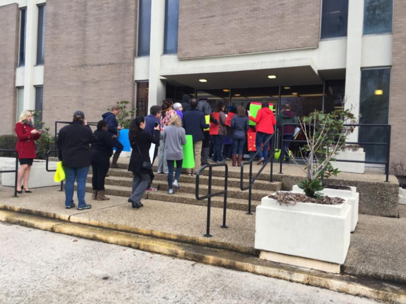 A group of protesters gather in front of Little Rock School District headquarters Tuesday morning.