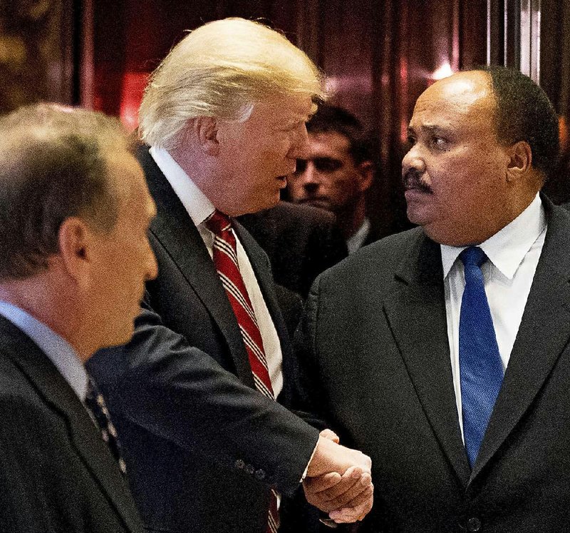 President-elect Donald Trump shakes hands with Martin Luther King III, the son of civil-rights leader Martin Luther King Jr., on Monday at Trump Tower in New York.