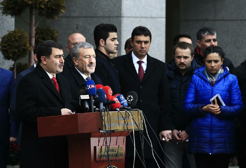 Istanbul province Gov. Vasip Sahin (left), standing next to Police Chief Mustafa Caliskan (second from left), talks Tuesday at a news conference about the arrest of a suspect in the New Year’s nightclub attack in Istanbul. 