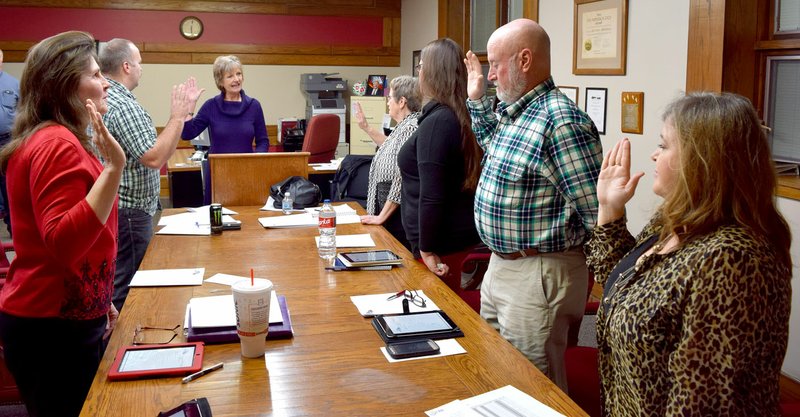 Photo by Mike Eckels Decatur City Council members and the city clerk took the oath of office administered by Tena O&#8217;Brien (center), Benton County Clerk, on Jan. 9 in the conference room at city hall. Those participating in the ceremony included Sandy Duncan, James Jessen, Tena O&#8217;Brien, Linda Martin, Ladale Clayton, Bill Montgomery and Kim Wilkins (city clerk). Not pictured was Robin Holts, who took the oath later in the evening.