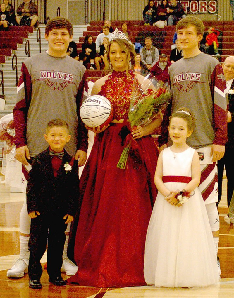 Photo by Mark Humphrey/Enterprise-Leader/Lincoln Colors Day queen Emily Dayberry poses with escorts Dalton Lee and Bryce Means accompanied by attendants Travis Perez and Daelyn Collins. The Wolves celebrated their Colors Day Friday.