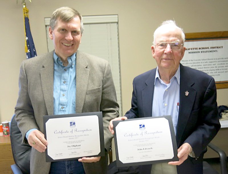 Photo by Susan Holland Since January is School Board Member Recognition Month in Arkansas, members of the Gravette Public School board were honored with certificates of recognition at the January meeting of the board Monday night. Jay Oliphant, board president, and John Edwards, vice-president, display their copies of the certificate which was presented to all board members by Richard Page, superintendent of Gravette schools. Board members will also be recognized at halftime of the Gravette-Pea Ridge basketball game Friday night.