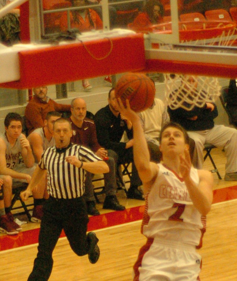 MARK HUMPHREY ENTERPRISE-LEADER Finishing on the fast-break. Cardinal senior guard Matthew Wilson&#8217;s ability to get to the basket and score in traffic makes him a threat inside the paint. Here he puts in two of his 25 first-half points versus Siloam Springs of his 49 total on Jan. 3. On Friday, Wilson surpassed that with a new single-game school record of 50 against Clarksville.