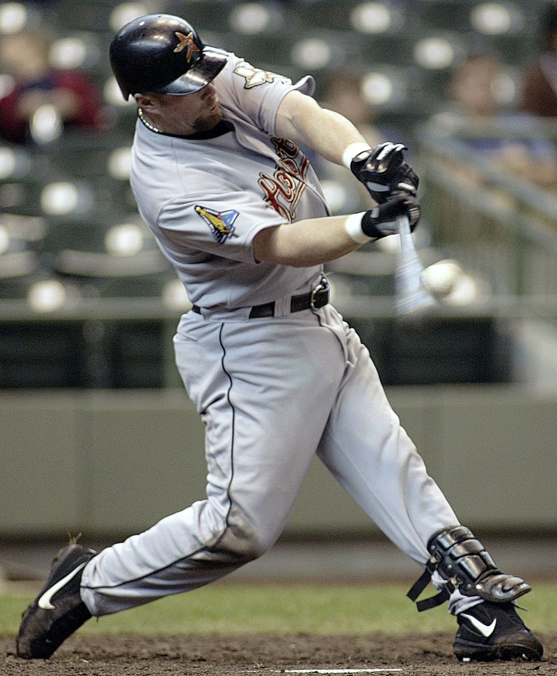 FILE - In this April 20, 2003, file photo, Houston Astros' Jeff Bagwell hits a home run against the Milwaukee Brewers in the fifth inning of a baseball game in Milwaukee. Bagwell and Tim Raines are likely to be voted into baseball's Hall of Fame on Wednesday, Jan. 18, 2017, when Trevor Hoffman and Ivan Rodriguez also could gain the honor. (AP Photo/Darren Hauck, File)