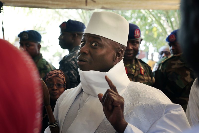 FIn this Thursday, Dec. 1, 2016 file photo, Gambia's President Yahya Jammeh shows his inked finger before voting in Banjul, Gambia. Gambia's President Yahya Jammeh declared a state of emergency on Tuesday, Jan. 17, 2017, just two days before he is supposed to cede power after losing elections last month. 