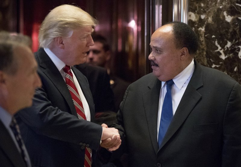 President-elect Donald Trump shakes hands with Martin Luther King III, son of Martin Luther King Jr. at Trump Tower in New York, Monday, Jan. 16, 2017. (AP Photo/Andrew Harnik)