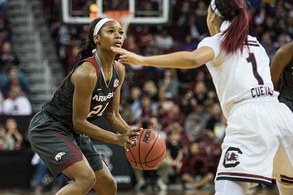 Arkansas guard Jordan Danberry, left, attempts a shot against South Carolina guard Bianca Cuevas (1) during the first half of an NCAA college basketball game on Sunday, Jan. 3, 2016, in Columbia, S.C. South Carolina defeated Arkansas 85-32. (AP Photo/Sean Rayford)

