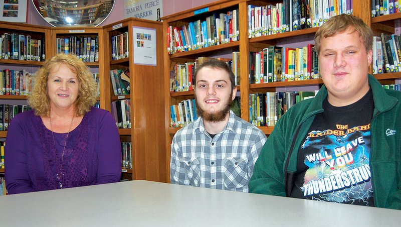 From left, Sheila Morgan, biology and environmental-science teacher at Riverview High School; Dylan Brown, senior; and Dalton Pruitt, junior, were a part of the proposal that was presented to the Searcy City Council for the construction of a new sidewalk at the school. All of Morgan’s environmental-science students worked on the project, and Brown and Pruitt were the students who represented the class to the City Council.