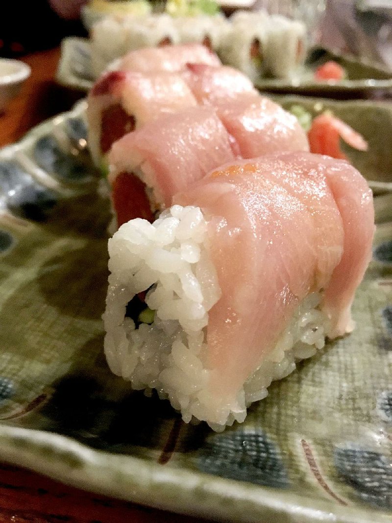 The Trust Me sushi roll at Shogun features a core of spicy tuna topped with yellowtail. 