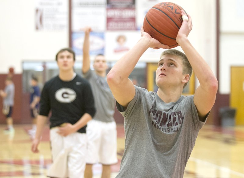 Austin Morris warms up Jan. 3 before a game against Haas Hall. Morris missed several games because of an injury he suffered while mountain biking.