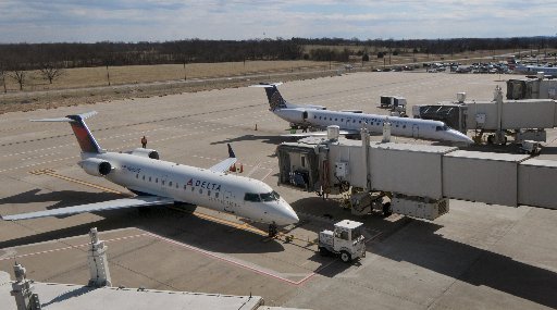 Airplanes sit at the gate on Thursday March 3, 2016 at Northwest Arkansas Regional Airport in Highfill.