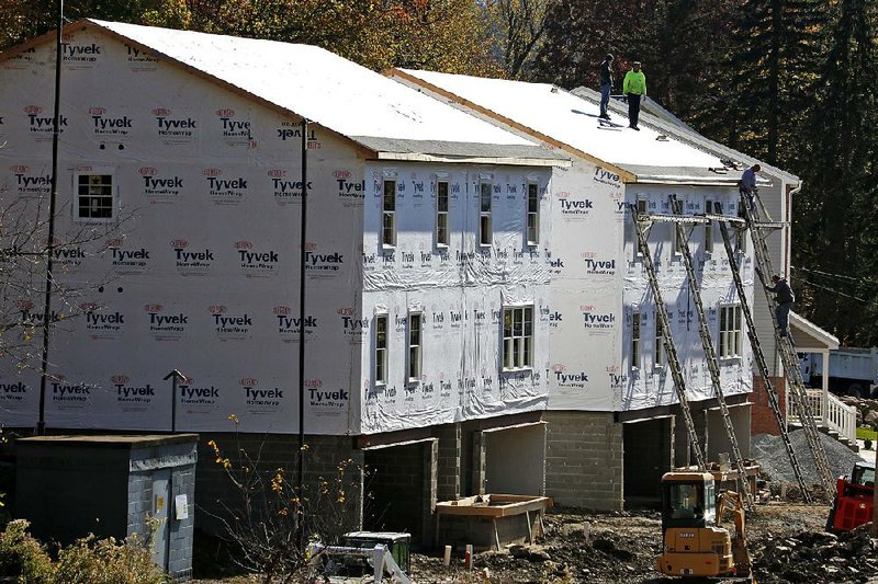 Construction continues on new houses in Canonsburg, Pa., as housing starts rose 11.3 percent in December, the Commerce Department said Thursday.
