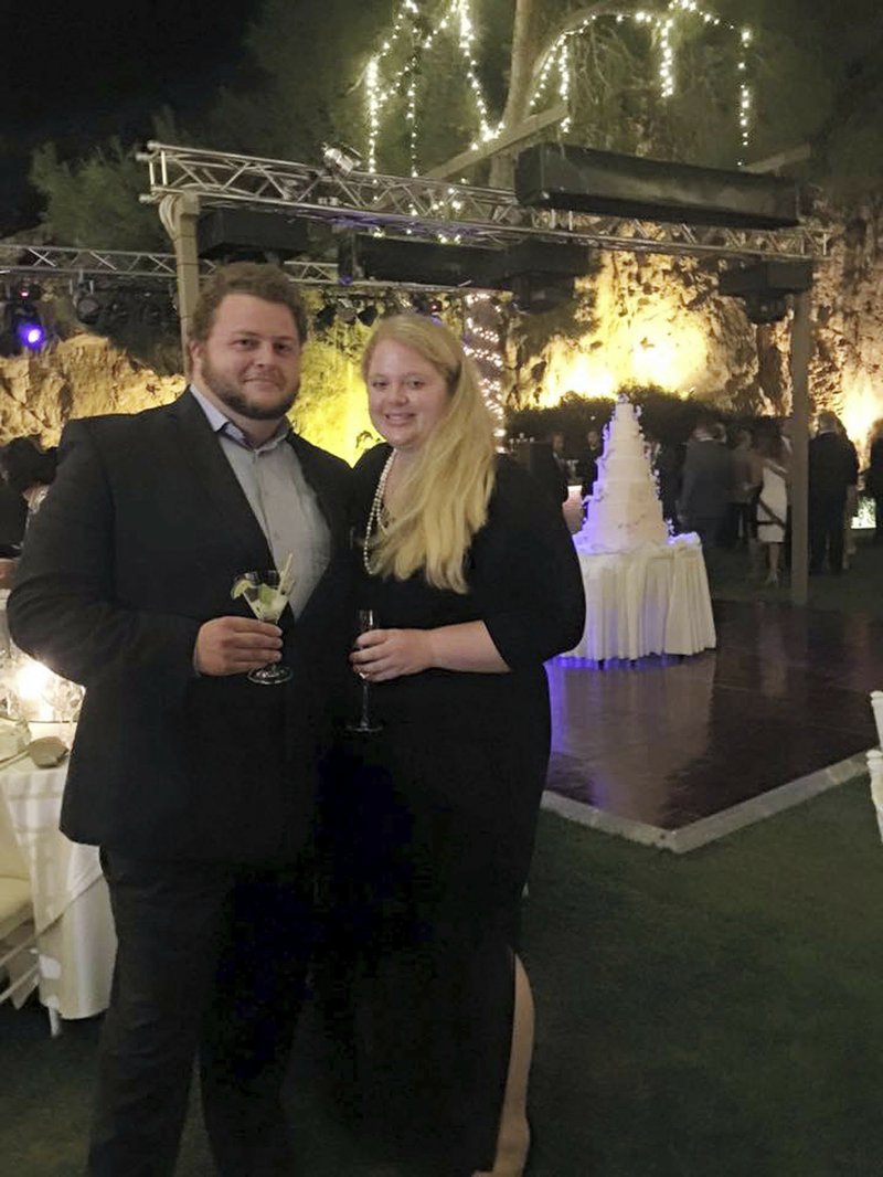 This 2015 file family photo shows Alexander Pinczowski and his fiance Cameron Cain in Greece. The families of victims of terror attacks in Paris, Brussels and Israel including Alexander and sister Sascha Pinczowski, said social media companies including Facebook and Twitter are aiding terrorists. 