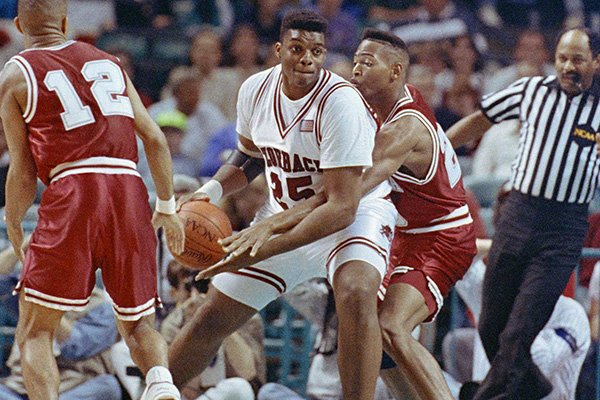 Alabama’s Robert Horry, right reaches in on Arkansas’ Oliver Miller (25) during first half action in the NCAA Southeast Regional on Thursday, March 21, 1991 at the Charlotte Coliseum in Charlotte, N.C. (AP Photo/Lynne Sladky)