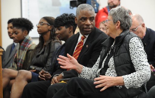 Washington County Judge Joseph Wood (center) speaks Tuesday, Jan. 3, 2017, with Washington County District 14 Justice of the Peace Ann Harbison during a swearing in ceremony in the Quorum Courtroom in the Washington County Courthouse in Fayetteville. 