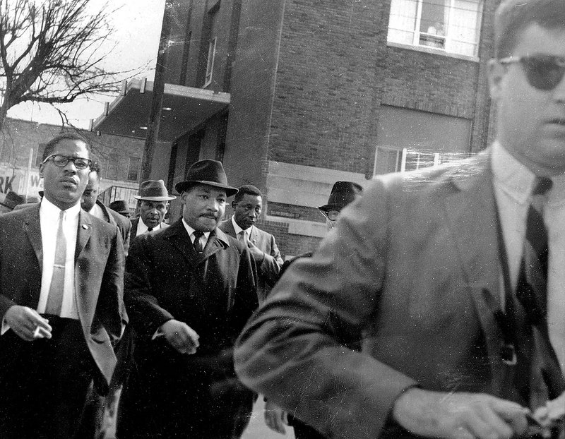 Fayetteville attorney Jim Rose III (right) walks ahead of Martin Luther King Jr. as he leads a march alongside local preachers in 1965 in Selma, Ala., after Rose had taken a photograph of the group. Rose was a military intelligence officer assigned to Alabama in 1963-1966 where he witnessed the Civil Rights struggle in Selma and collected information about Martin Luther King Jr.’s time there.