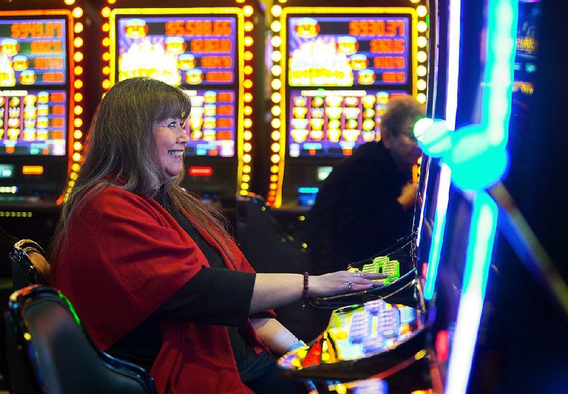 Pam Thurman of Grove, Okla., tries her luck at the new Cherokee Casino in her hometown.
