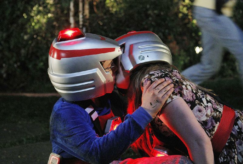 Sean Giambrone (left) as Adam and Natalie Alyn Lind as Dana kiss in a scene from the ABC comedy series, The Goldbergs.
