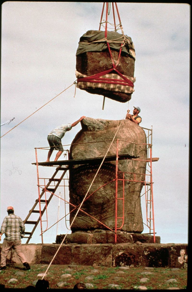 Workers install the head on the First Amendment monument being erected on the Capitol grounds. Fayetteville-born Otus the Head Cat’s award-winning column of humorous fabrication appears every Saturday.
