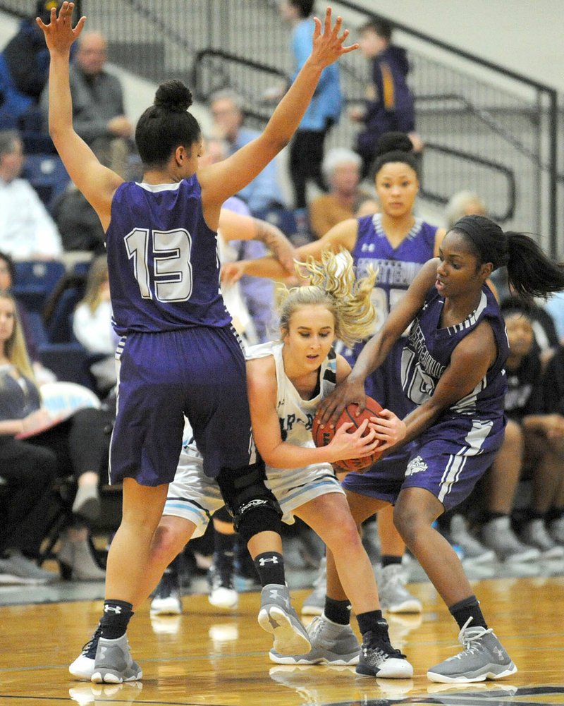 NWA Democrat-Gazette/ANDY SHUPE Maya Mayberry (10) and Kylee Coulter (13) of Fayetteville pressure Annabel Weber of Springdale Har-Ber on Friday at Wildcat Arena.