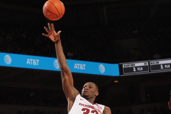 Moses Kingsley (33) of Arkansas takes a shot over Antonio Blakeney (2) of LSU Saturday, Jan. 21, 2017, during the second half of play in Bud Walton Arena. Visit nwadg.com/photos to see more photographs from the game.