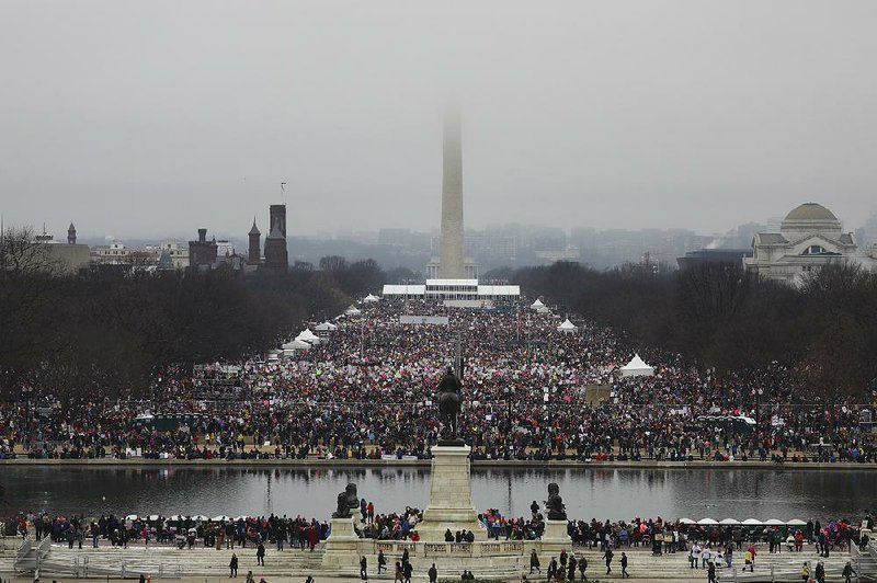 People crowd into the National Mall for the Women’s March on Washington, one of several protests around the nation and the world Saturday, the day after President Donald Trump’s inauguration. 