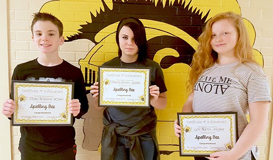 Submitted photo Blake McLelland won first place in the Hot Springs Middle School spelling bee on Jan. 10. Bonnie Shannon, center, placed second, and Lori Martin placed third.