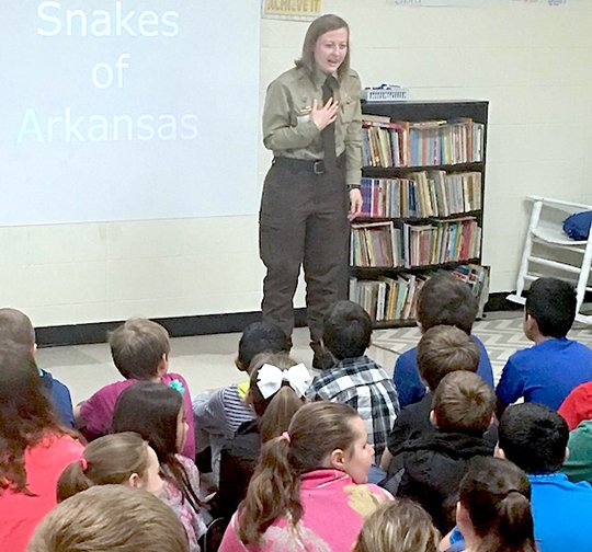 Submitted photo Lake Ouachita State Park interpreter Kayla Gomance recently spoke to students in Jessieville Elementary School's fourth-grade Conservation Club about venomous snakes in Arkansas, as well as other wildlife in the park.