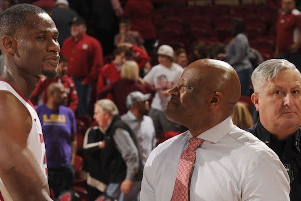 Moses Kingsley (left) shakes hands with Arkansas coach Mike Anderson after the Hogs' 99-86 win over LSU Saturday, Jan. 21, 2017, in Bud Walton Arena.