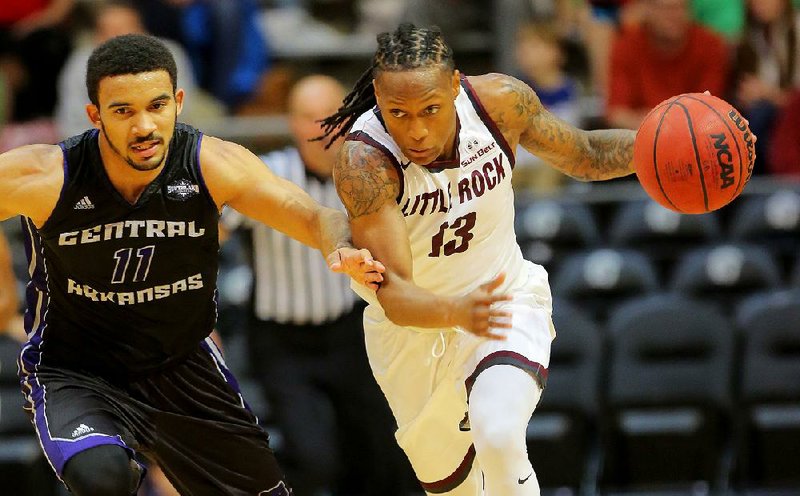 UALR guard Marcus Johnson (right) is coming off a 22-point outing in Saturday’s game for the Trojans, who are three games out of first place in the Sun Belt standings going into tonight’s game against Troy.