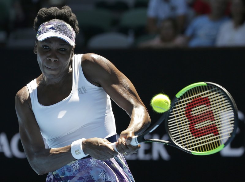 The Associated Press RETURN FROM VENUS: United States' Venus Williams makes a backhand return to Germany's Mona Barthel during their fourth round match at the Australian Open tennis championships in Melbourne, Australia, Sunday.