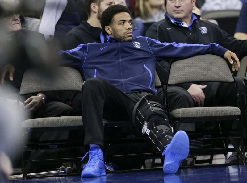 The Associated Press WATSON OUT: Creighton's Maurice Watson Jr., out for the season due to a torn ACL, sits on the bench during the second half of Saturday's game against Marquette in Omaha, Neb. Marquette won 102-94.