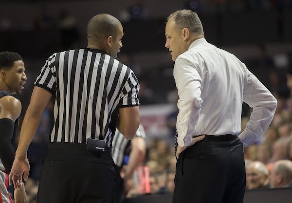 Georgia head coach Mark Fox talks with a referee during the second half of an NCAA college basketball game against Georgia in Gainesville, Fla., Saturday, Jan. 14, 2017. Florida won in overtime 80-76. (AP Photo/Ron Irby)