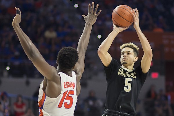 Vanderbilt guard Matthew Fisher-Davis (5) shoots a jump shot over Florida center John Egbunu (15) during the second half of an NCAA college basketball game in Gainesville, Fla., Saturday, Jan. 21, 2017. Vanderbilt won 68-66. (AP Photo/Ron Irby)