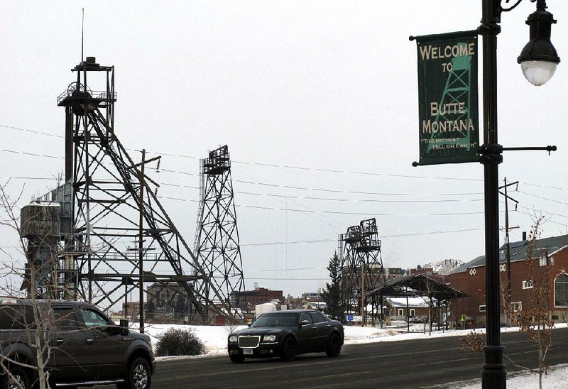 Old mining headframes dominate the skyline of Butte, Mont., last month. A pit of contaminated water is expected to reach a critical level in 2023, raising the risk that it could spill into other waterways and Butte’s groundwater.