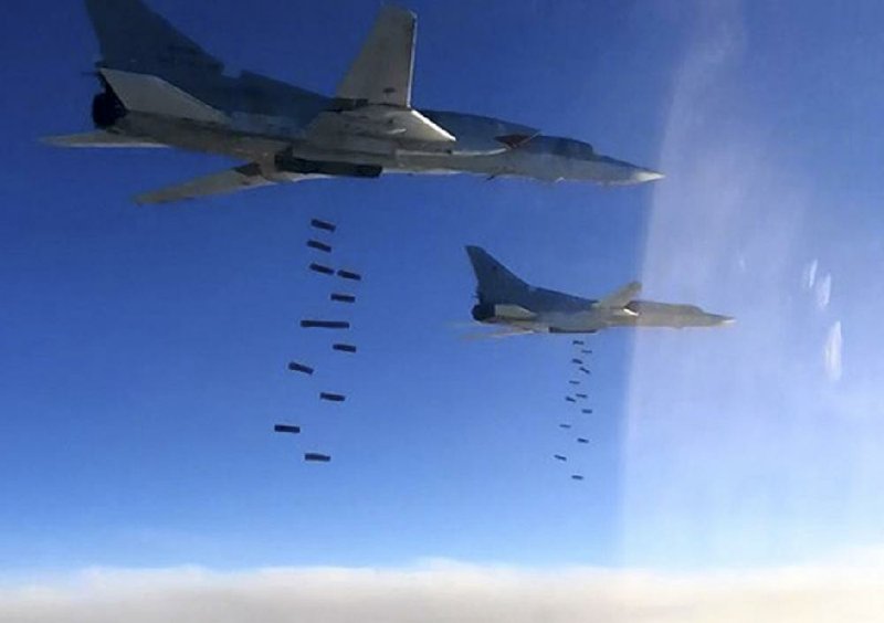 Russian Tu-22M3 bombers strike targets from the Islamic State militant group Monday in Syria. The U.S. denied a Russian claim that the two countries are coordinating in striking against militants.