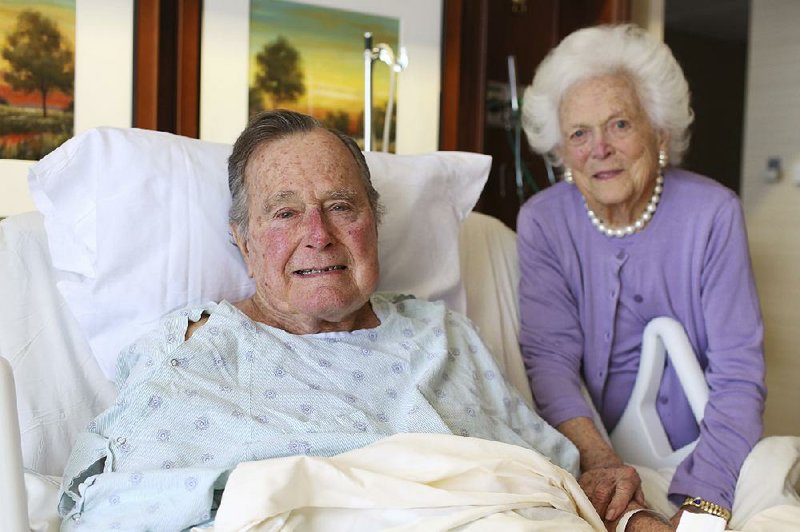 George H.W. Bush and his wife, Barbara, pose at Houston Methodist Hospital in this photo provided Monday by the former president’s office.