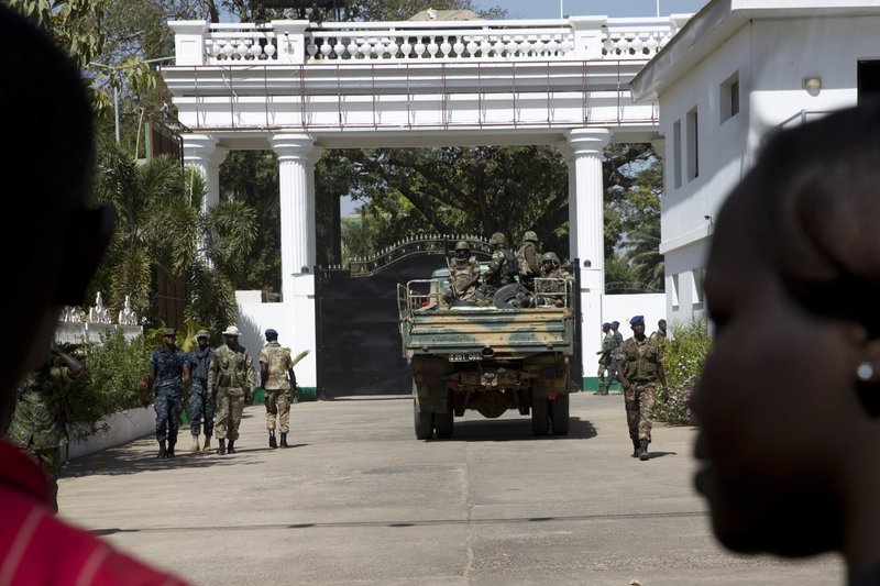 Senegalese troops enter the State House in Banjul, Gambia, Monday Jan. 23, 2017, two days after Gambia's defeated leader Yahya Jammeh left the country. Troops of Economic Community of West African States have moved into the State House to prepare for the return of new President Adama Barrow.